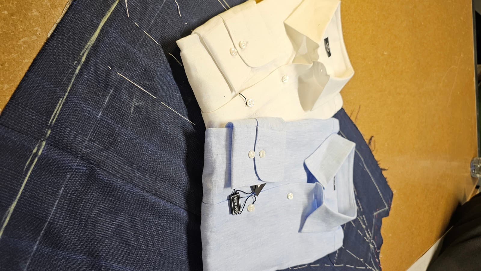 Two linen shirts on chalked navy suiting
